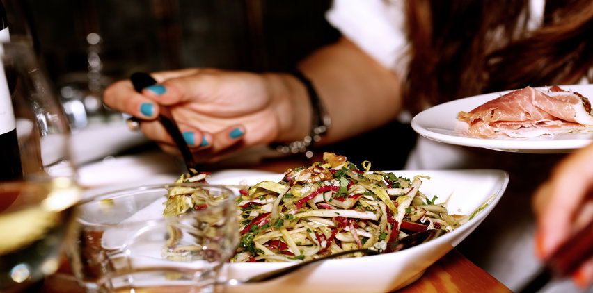 hungry woman filling plate