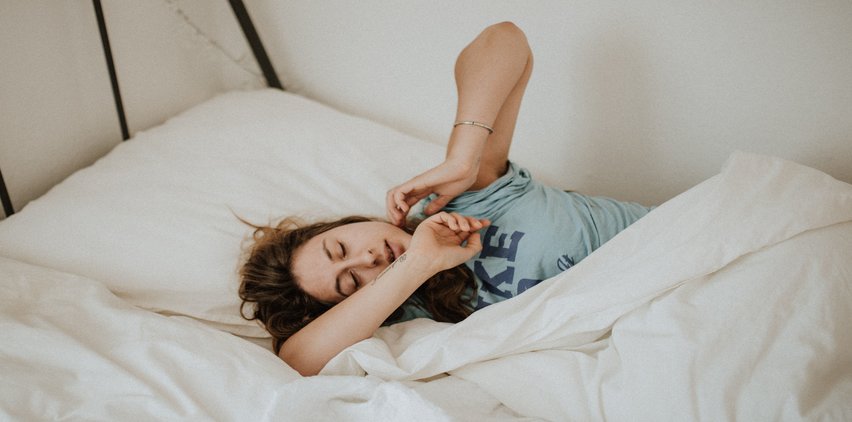 woman lazy in bed sleeping