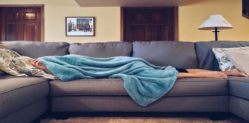 person sleeping on couch