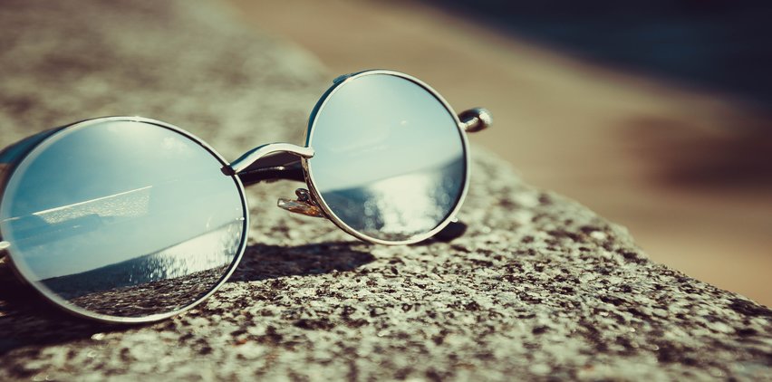 sunglasses reflecting beach