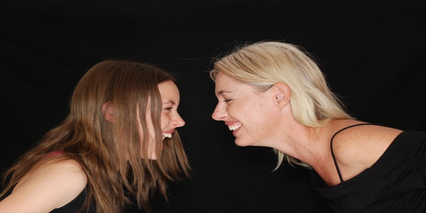 mom and daughter laughing