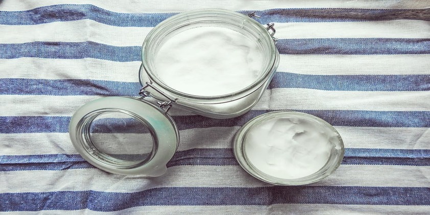 Pexels. Jar of cream on a blue and white striped blanket