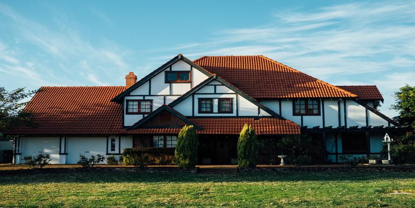 Unsplash. White House with brown roof