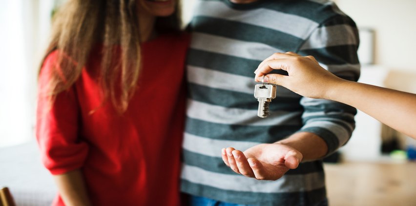 couple getting keys to their new home