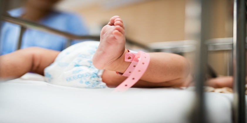 Pexels. Baby girl in hospital bed