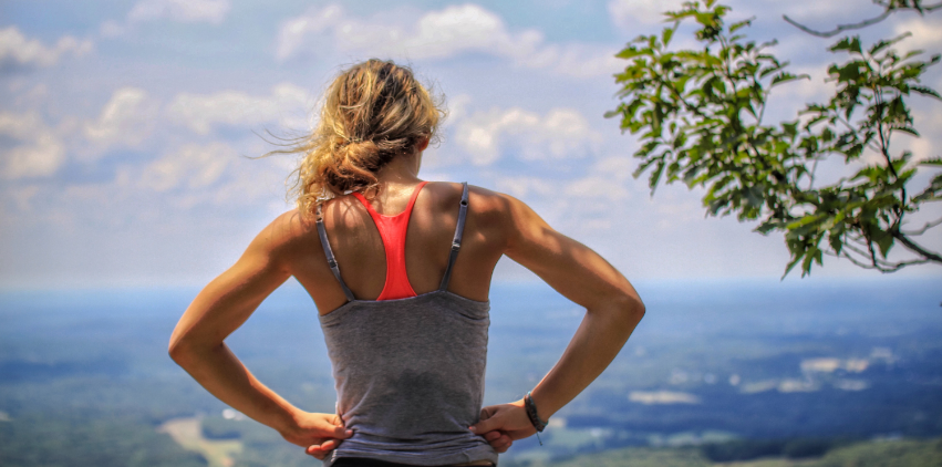 A woman takes a break after going for a run
