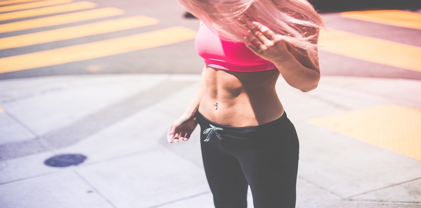 Woman with fit abs from low carb diet