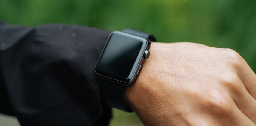 A man wears an activity tracker.