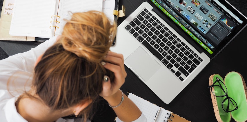 A woman feeling burned out at work