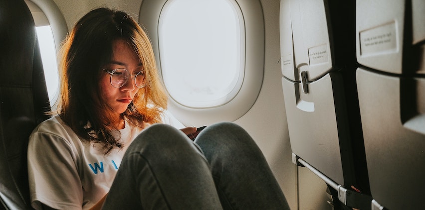 A woman sitting in an airplane